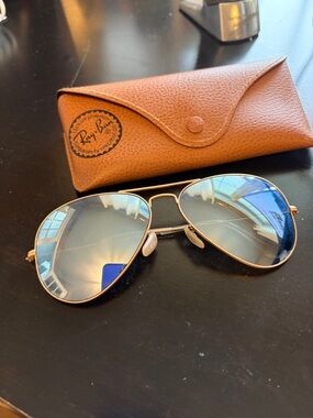 Ray-Ban women’s Gold Frame Sunglasses with Blue Mirrored Lenses